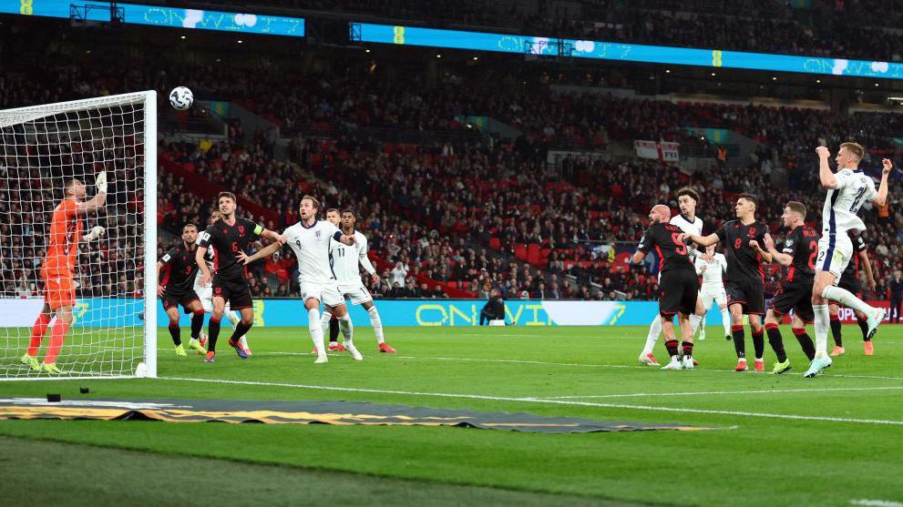 England defender Dan Burn heads against the bar at Wembley