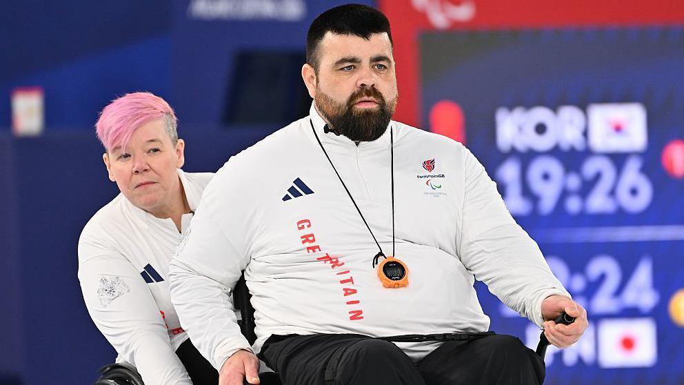 Great Britain wheelchair curlers Jo Butterfield and Jason Kean in action