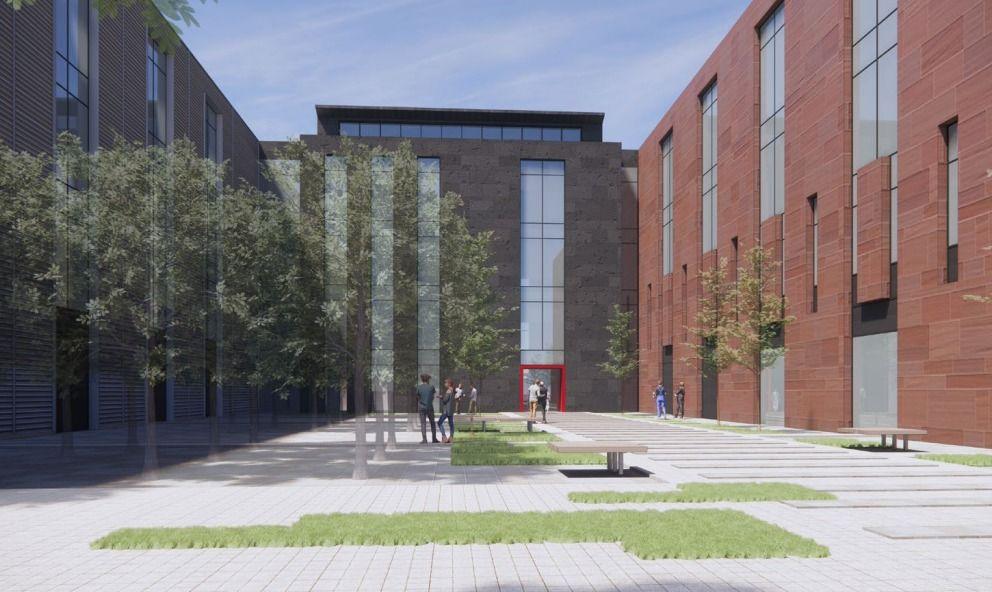 An artist's impression of the facility's courtyard with trees and grass surrounded by a large brown and grey building