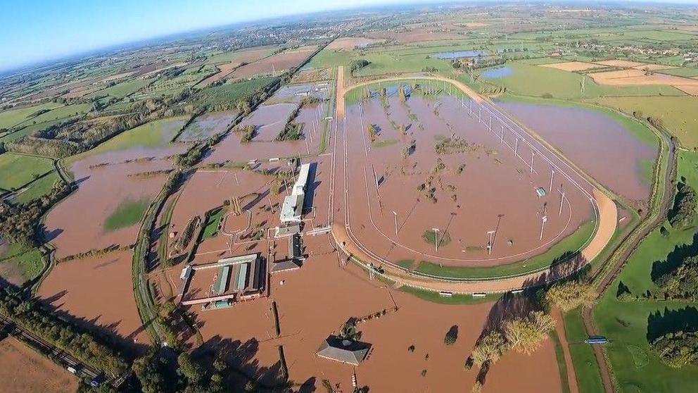 An aerial view of Southwell Racecourse submerged under water.