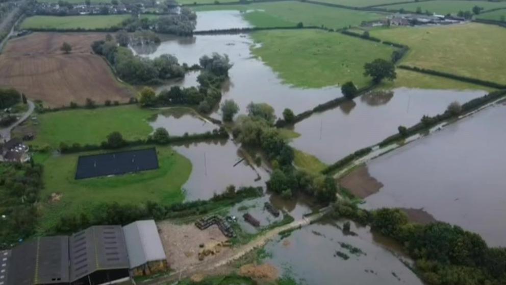 An aerial shot of a flooded dairy farm