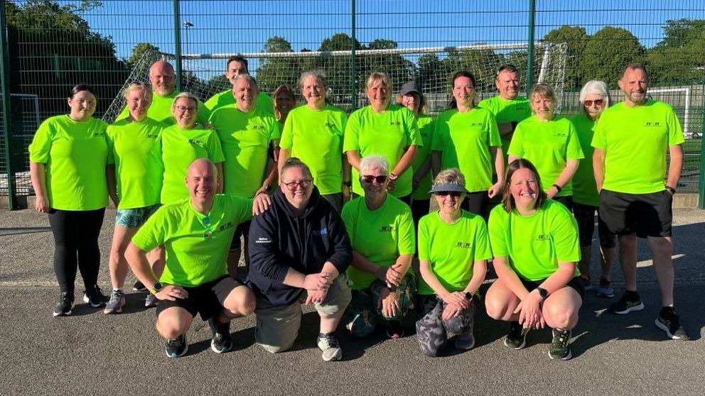 A group in bright green shirts