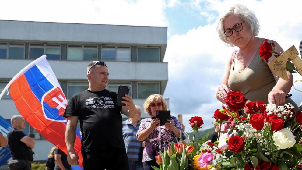 People lay flowers in Slovakia