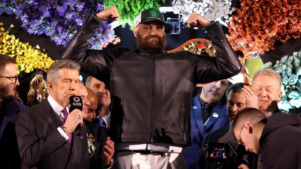 Tyson Fury weighs in, still wearing his clothes including a leather jacket