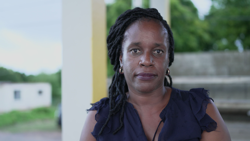 Pamela Riley sitting outside a home on Anguilla