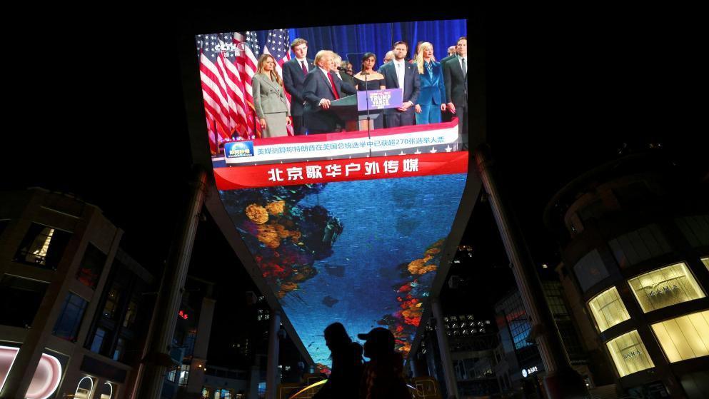 A giant screen displays footage of Republican Donald Trump during a news bulletin on the U.S. election, at a shopping complex in Beijing, China November 6, 2024