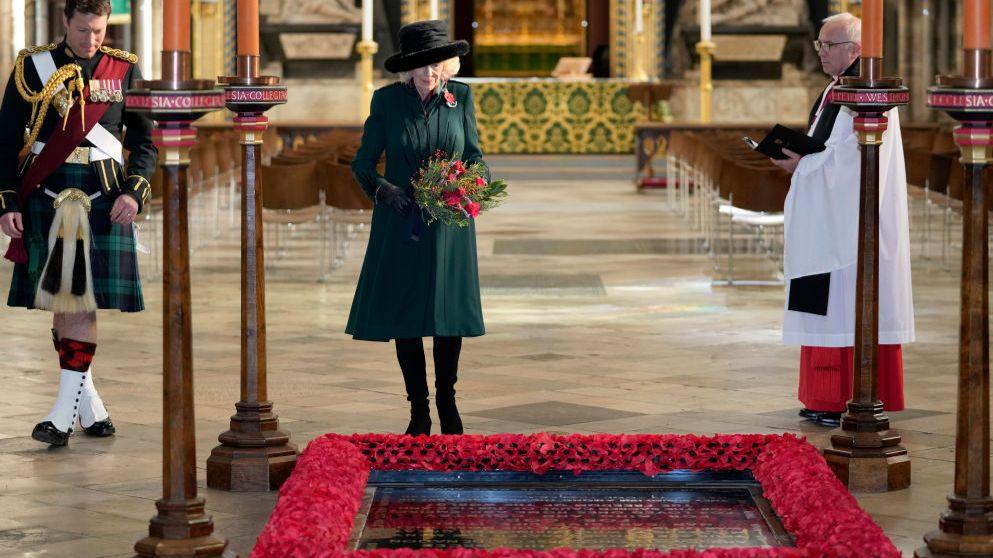 Camilla, then Duchess of Cornwall, lays flowers as she visits the Grave of the Unknown Warrior at Westminster Abbey on 11 November 2021