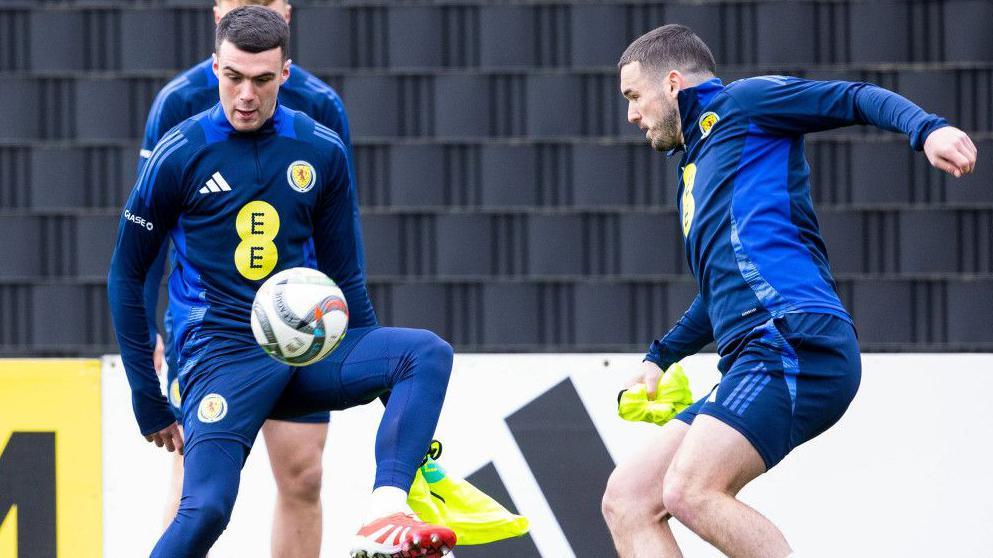 Scotland squad midfielders Lennon Miller and John McGinn during training