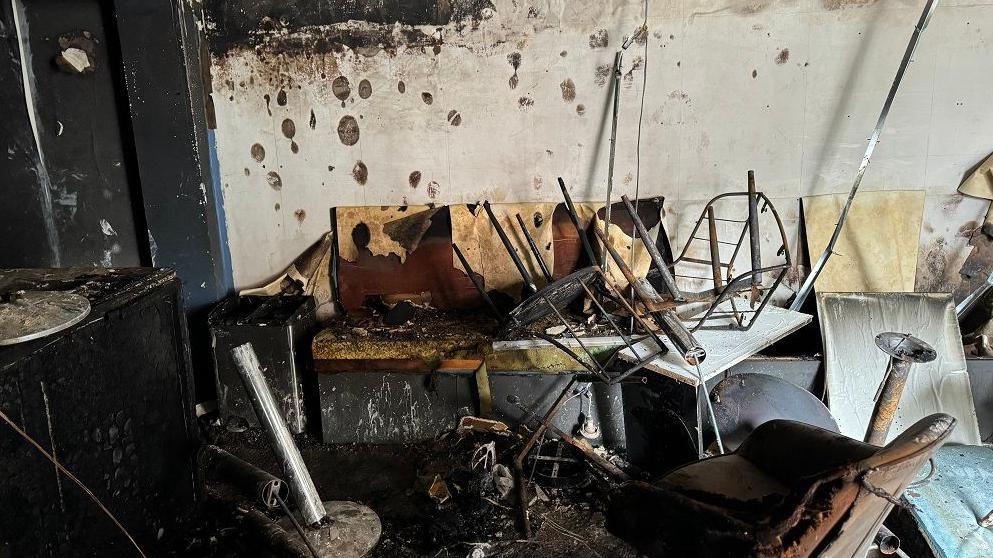 Damage following an attack on a cafe in south Belfast in August