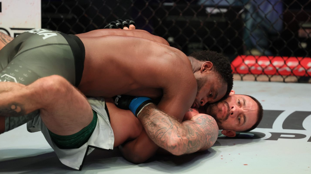 Donegi Abena puts his head into Joe Schilling