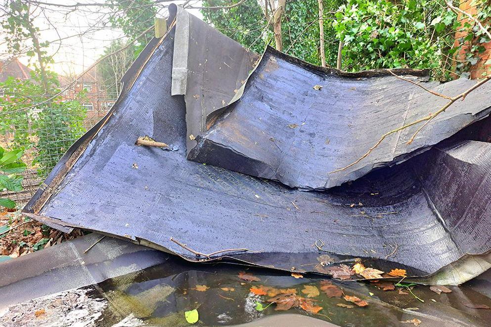 What looks like a plastic or felt roof is left on the ground in Northfield, Birmingham