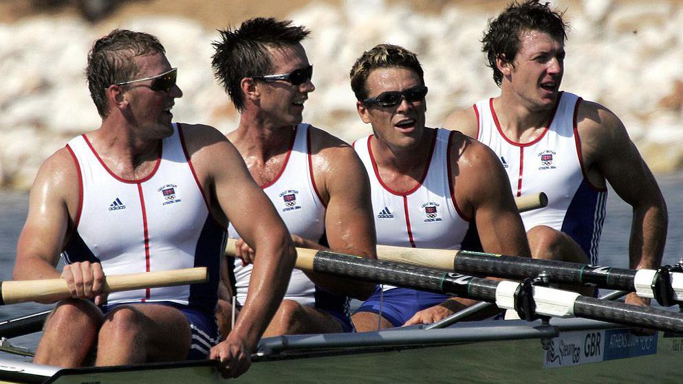 ATHENS, Greece: (R-L) British Steve Williams, James Cracknell, Ed Coode and Matthew Pinsent celebrate after finishing first ahead of Australia in second place to win gold and silver respectively in the Men's Four final for the Athens 2004 Olympic Games at the Schinias Rowing and Canoeing Center, outside Athens, 21 August 2004. 