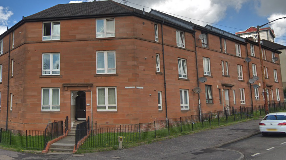 Block of red sandstone flats on Elmvale Street in Springburn