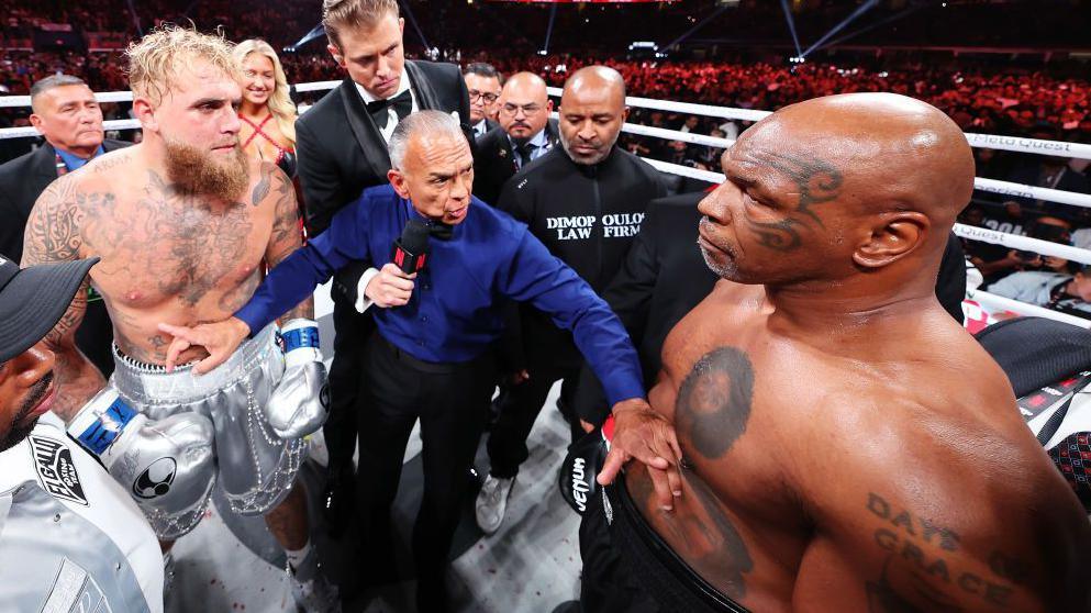 Jake Paul and Mike Tyson square off in the ring