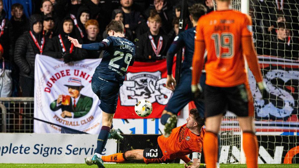 Hearts' James Penrice scores to make it 1-0 during a William Hill Premiership match between Dundee United and Heart of Midlothian at The CalForth Construction Arena at Tannadice Park,