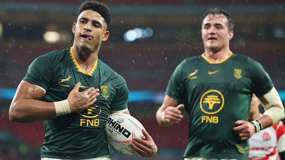 Sacha Feinberg-Mngomezulu pats his shirt in celebration