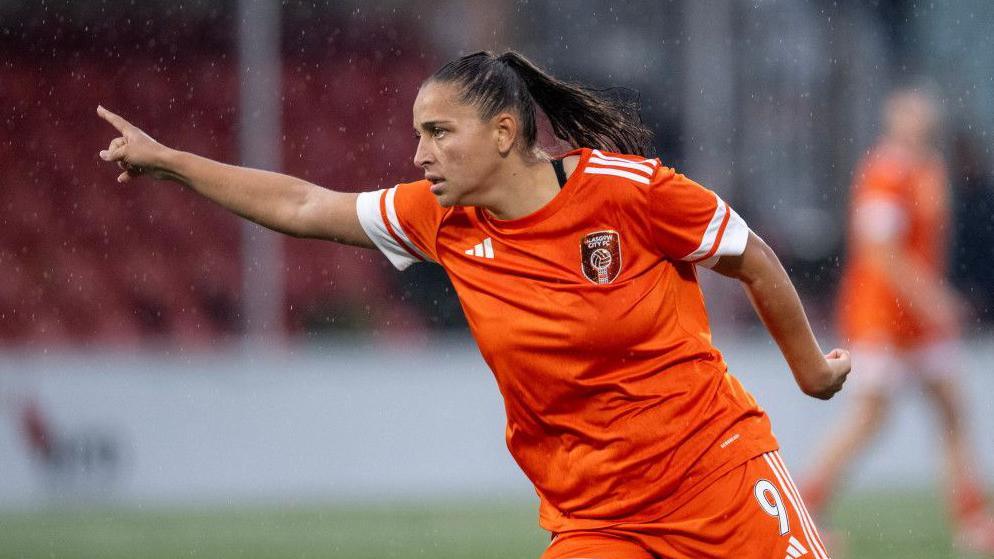 Abi Harrison celebrates