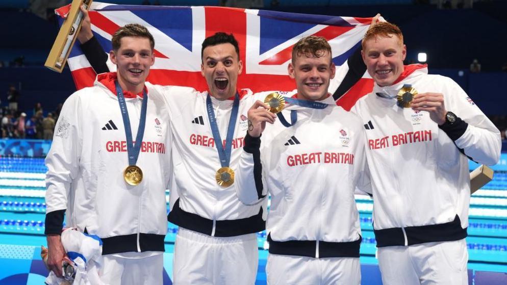 Left to right - Great Britain's Duncan Scott, James Guy, Matthew Richards and Tom Dean pose with their gold medals after winning the Men's 4 x 200m Freestyle Relay Final at the Paris La Defense Arena on the fourth day of the 2024 Paris Olympic Games