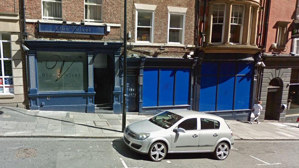 An external picture of Blue Velvet on Dean Street. The windows of the club have been painted blue.