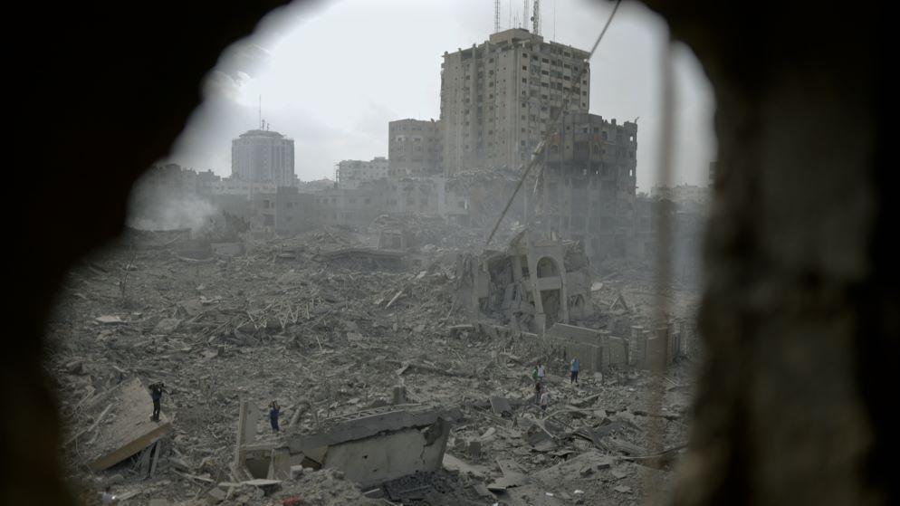 Scene of destruction in Gaza, with buildings turned to rubble seen through a hole