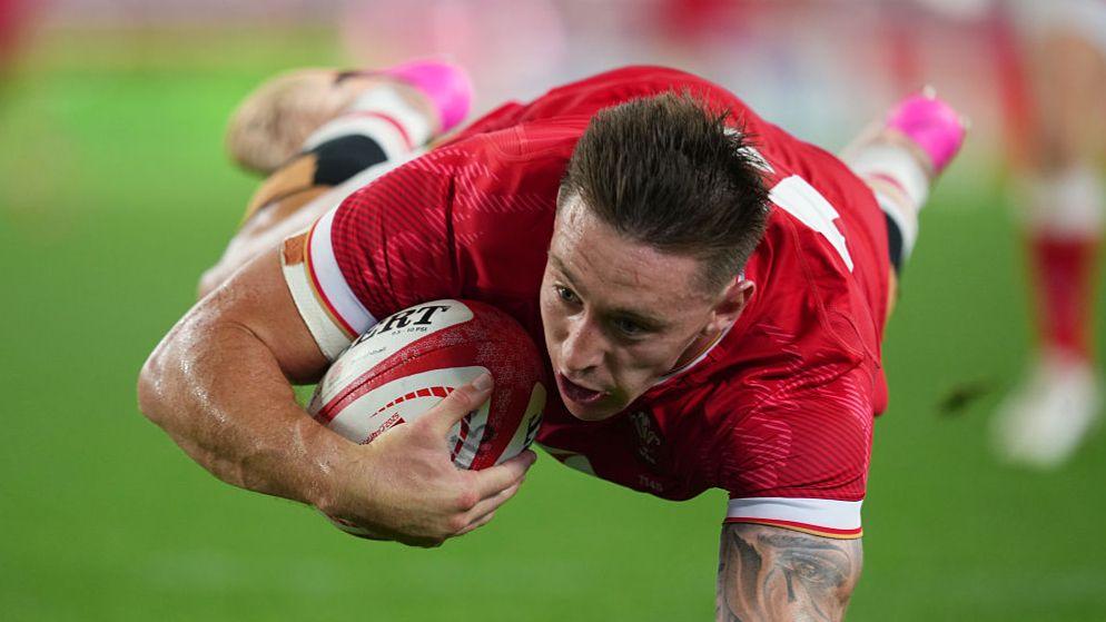 Wing Josh Adams scored the first of Wales' four tries in Kobe
