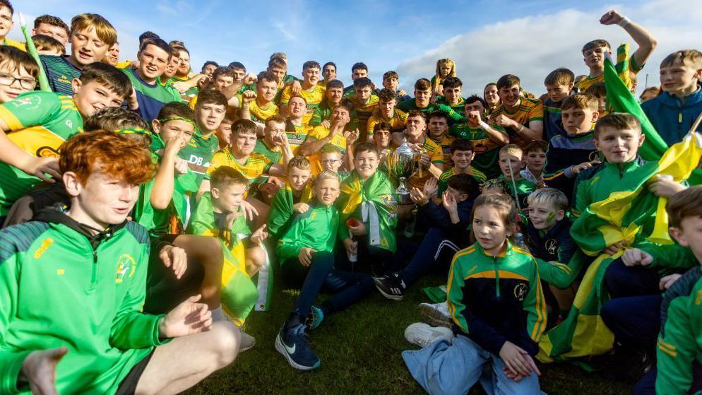 Dunloy players and supporters with the cup