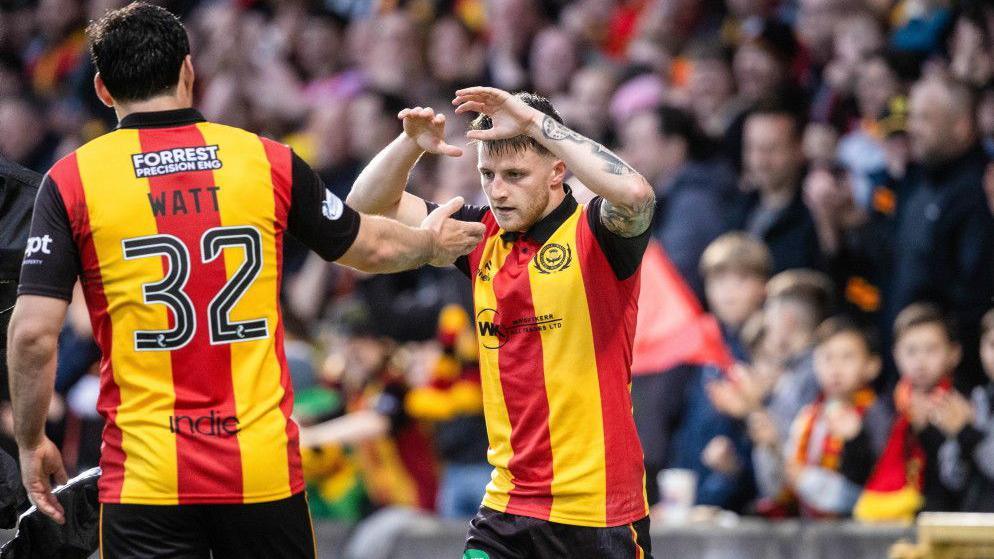 Partick Thistle's Aidan Fitzpatrick (R) celebrates with Tony Watt after scoring to make it 1-1 during a William Hill Premiership Playoff Final First Leg match between Partick Thistle and St Mirren at The Wyre Stadium at Firhill, on May 21, 2026, in Glasgow, Scotland.
