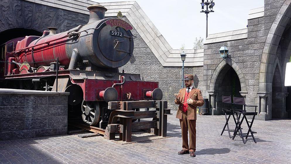 A red Hogwarts Express train is seen in "Wizarding World of Harry Potter" theme park at Universal Studios Hollywood