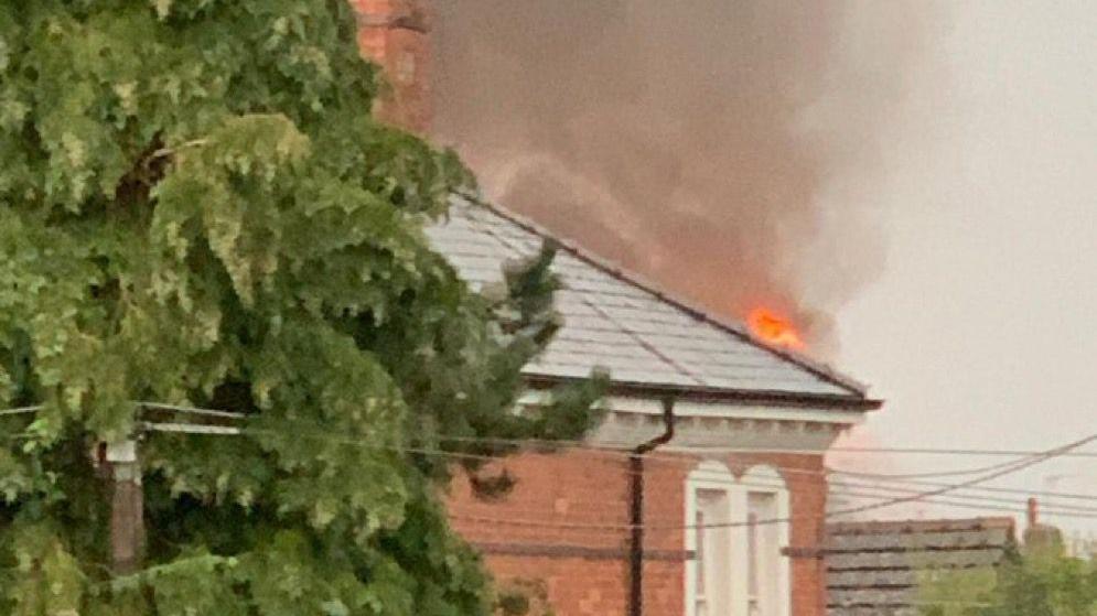 Fire from roof after lightning bolt