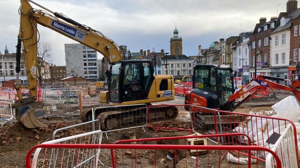 Two diggers dormant in the Market Square 