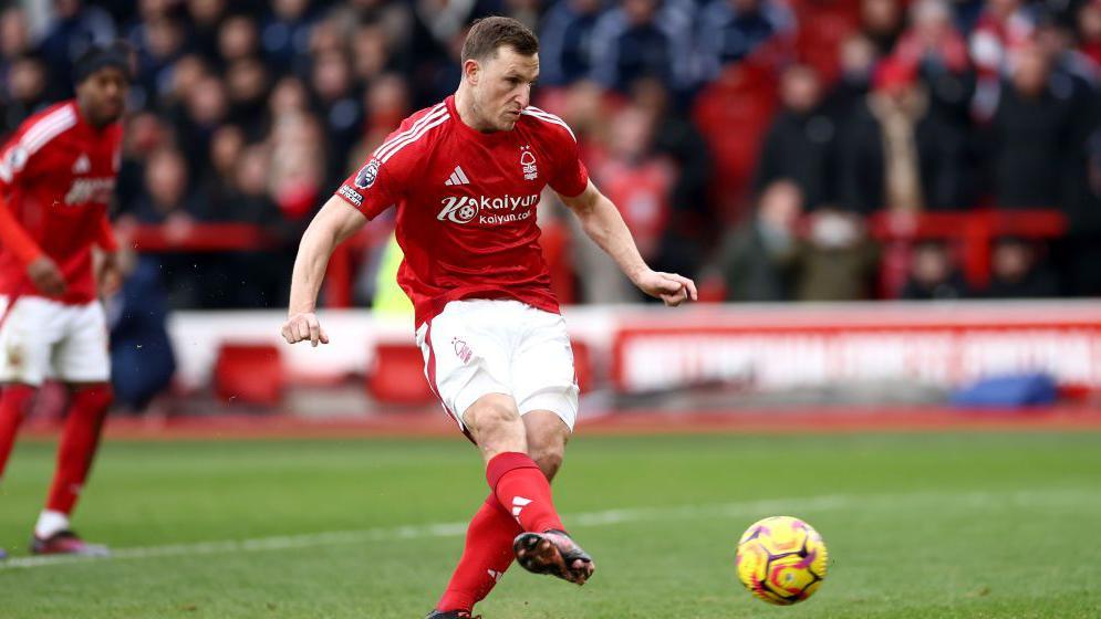 Chris Wood scores a penalty in Nottingham Forest's Premier League match at home to Brighton