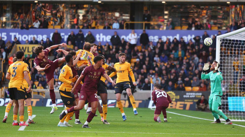 John Stones scores a header against Wolves