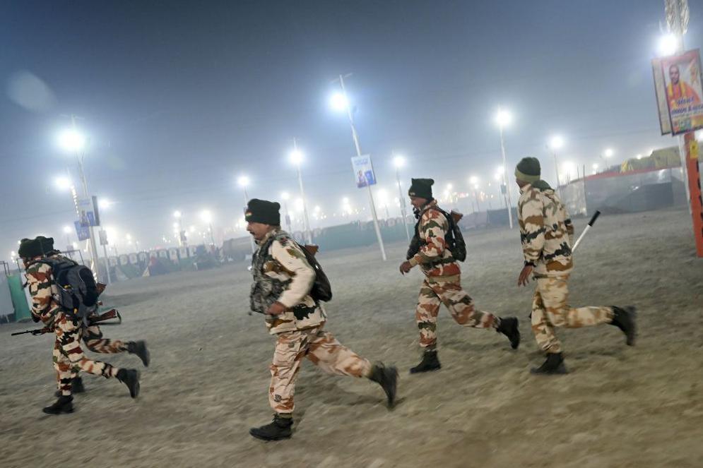 Security personnel arrive at the site of stampede amid the ongoing Maha Kumbh Mela festival in Prayagraj on January 29, 2025.