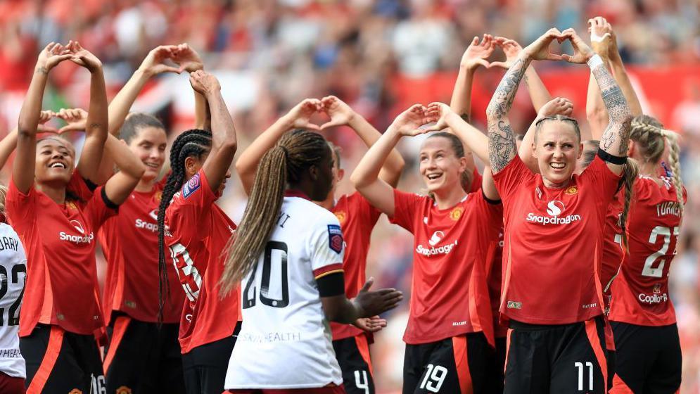 Manchester United celebrate after Leah Galton scores