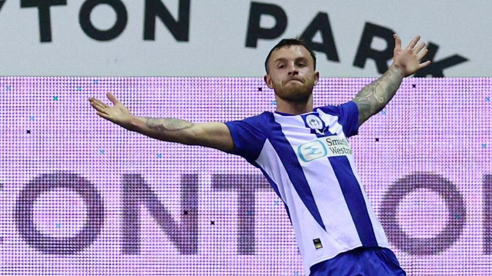 Dale Taylor celebrates scoring for Wigan against Huddersfield last season.