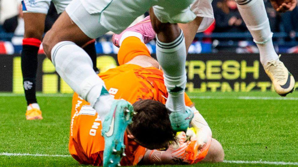 Celtic's Auston Trusty challenges Rangers' Jack Butland