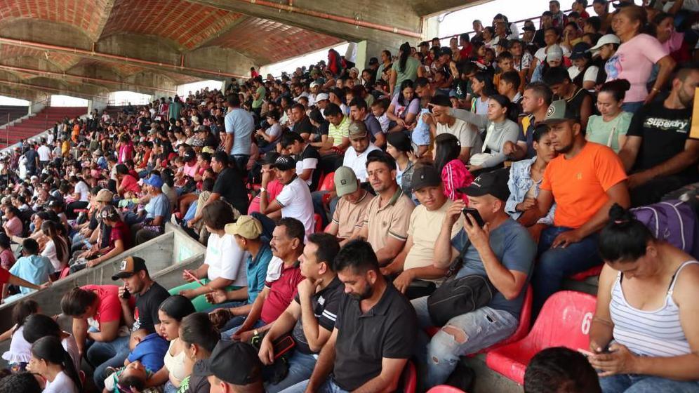 People displaced by violence are shown seated inside the General Santander stadium in Cucuta, Colombia, 19 January 2025. 