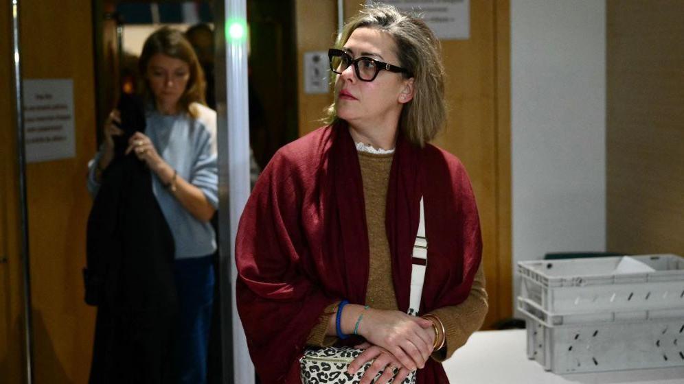 Gisèle Pelicot's daughter Caroline Darian gave evidence in court on Wednesday. Here she is leaving the court clasping her bag