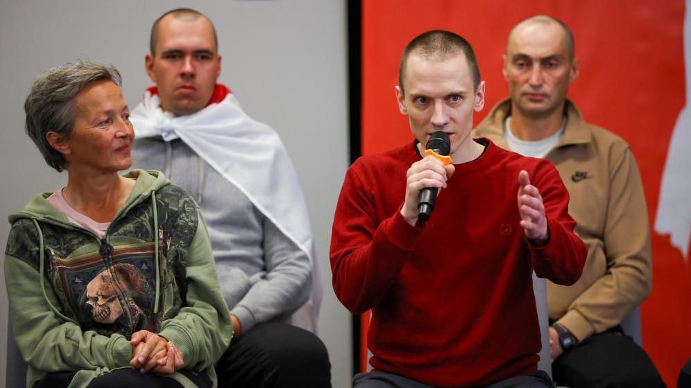 Mikalai Dziadok, one of the prisoners recently released from Belarus, speaks during a press conference 
