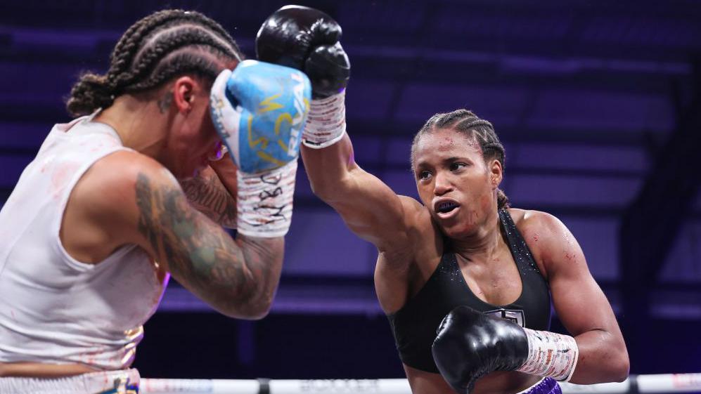 Caroline Dubois aims a punch at Jessica Camara