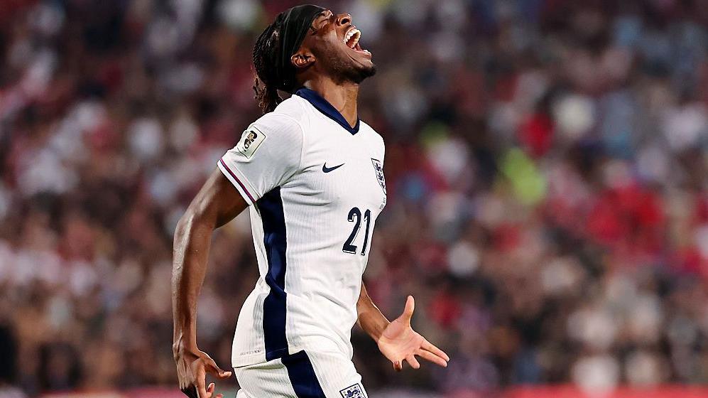 Noni Madueke celebrates after scoring his first England goal in the World Cup qualifying win in Serbia