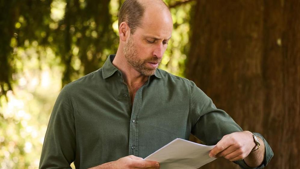 Image shows the Prince of Wales standing outside in a green shirt, recording opening scenes for new documentary series, Guardians