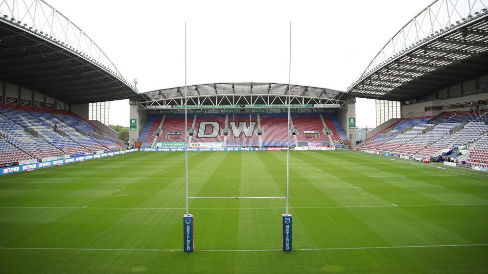 Rugby goal posts are set up at the Brick Community Stadium in Wigan, Greater Manchester ahead of a Wigan Warriors Super League match