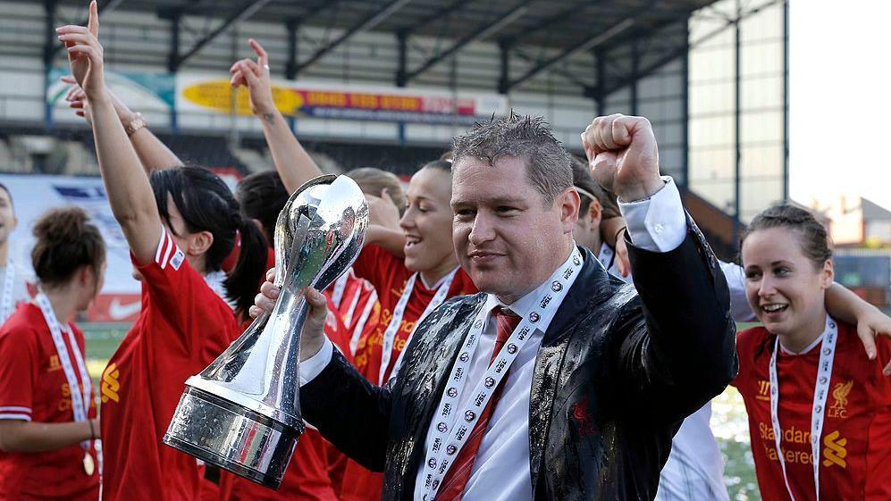 Matt Beard with the WSL trophy
