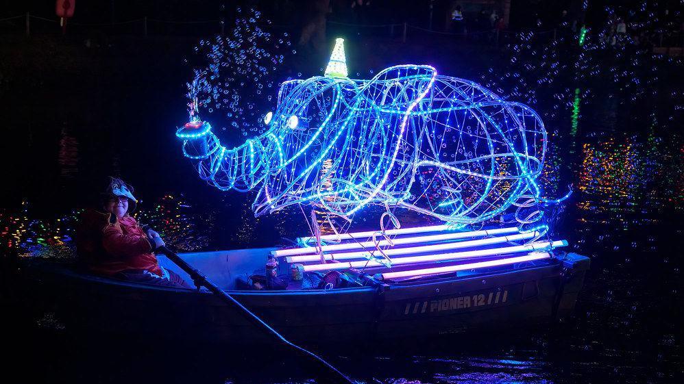 Brandon Gill riding a boat with an LED elephant on top