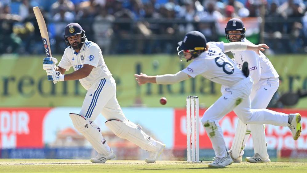 India captain Rohit Sharma hits past England fielderOllie Pope during day two of the 5th Test Match between India and England at Himachal Pradesh Cricket Association Stadium on March 08, 2024 in Dharamsala,