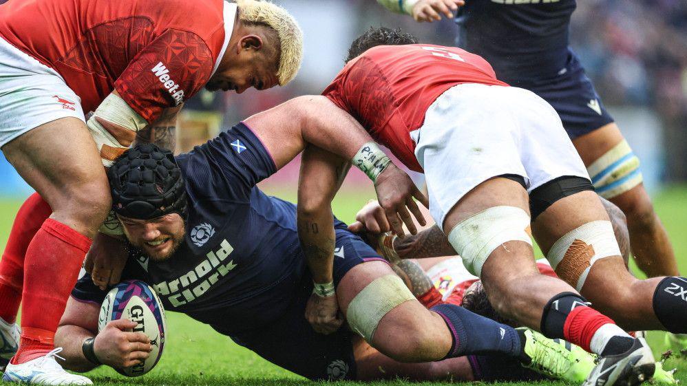 Scotland's Zander Fagerson reaches for the try line against Tonga
