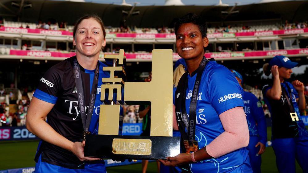 Heather Knight and Deepti Sharma with the women's Hundred trophy