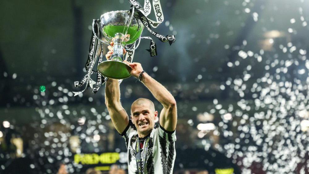 St Mirren's Alex Gogic lifts the trophy at Hampden