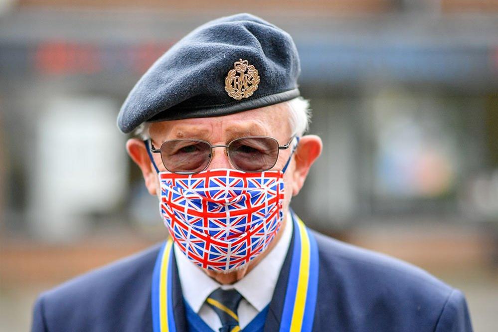 Ex RAF serviceman Tom Blundell wears a Union flag mask